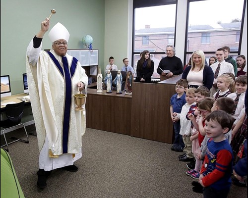 Bishop Murry blesses the new St. Barbara School library