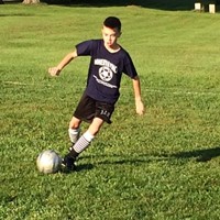 student playing soccer